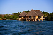 View over Indian Ocean to Water Bungalows, The Sands, Chale Island, Coast, Kenya