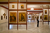 Woman looking at icons inside the Byzantine Museum, Icon Museum, Lefkosia, Nicosia, South Cyprus, Cyprus