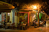 People sitting outside a cafe, coffee shop at night, Laiki Geitonia, Lefkosia, Nicosia, Cyprus