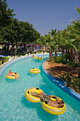 People floating in rubber tyres, WaterWorld, waterpark, Agia Napa, South Cyprus, Cyprus