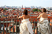 Art performance over city roofs, Berlin, Germany