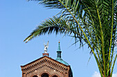Palm tree and roof of St. Michael Church, Berlin, Germany