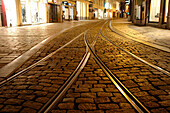 Tram lines in the Old Town of Ghent at night, Flanders, Belgium