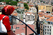 Woman overlooking the city, Istanbul, Turkey