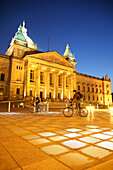 Two cyclists at Federal Administrative Court, Leipzig, Saxony, Germany