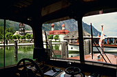 View of St. Bartholomews church at lake Konigssee from a boat, Berchtesgadener Land, Bavaria, Germany