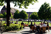 People sitting at a cafe at the Arts Centre, Kulturzentrum Kaserne, Basel, Switzerland