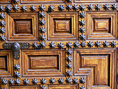 Wooden door of the Hostal de los Reyes Católicos, Santiago de Compostela. La Coruña province, Galicia, Spain