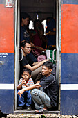 People waiting in the train at Senen train station of Jakarta, Indonesia, Southeast Asia