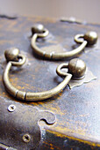 Antique, Antiques, Antiquities, Close up, Close-up, Closed, Closeup, Color, Colour, Concept, Concepts, Detail, Details, Elegance, Elegant, Handle, Handles, Indoor, Indoors, Inside, Interior, Metal, Metallic, Object, Objects, Pair, Thing, Things, Trunk, T