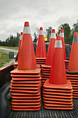 Road pilons used for road construction are piled up in the back of a pick-up truck, Canada