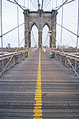 People walking on the Brooklyn Bridge. New York City. New York. United States