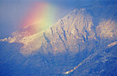 Rainbow over Pyrenees mountains in fall. Huesca province, Spain