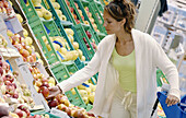 Woman buying fruit