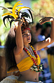 Young woman dancing a dance of welcome in the town of Hakahau on the Island of Ua Pou, French Polynesia