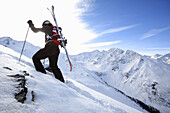 Skier ascending, See, ski region Paznaun, Tyrol, Austria