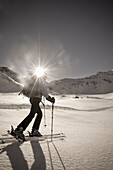 Woman backcountry skiing at Sonnblick range, Hohe Tauern National Park, Rauris, Salzburg (state), Austria