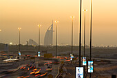 Dubai skyline in the evening light, Burj al Arab in the background, Traffic chaos, Dubai, United Arab Emirates