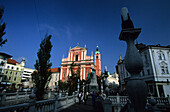 The historic old city of Ljubljana with Franciscan Church of the Annunciation and monument, Ljubljana, Slovenia