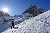 Female backcountry skier ascenting, Griesner Kar, Wilder Kaiser, Kaiser range, Tyrol, Austria