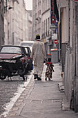 Immigrant father with child in the African Quarter, Barbes in the 18, 19e Arrondissement, Paris, France
