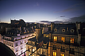 Evening view above the rooftops of Paris, 2e Paris, France