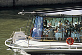 Les Bateaux, people at a restaurant boat on the Seine river, Paris, France, Europe