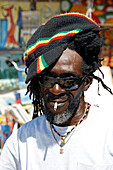 Jamaica Negril beach cool Rastafari man in front of fashion shop