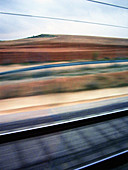 Blurred, Color, Colour, Daytime, Exterior, Fast, Landscape, Landscapes, Motion, Movement, Moving, Nature, Outdoor, Outdoors, Outside, Railroad, Railroads, Railway, Railways, Scenic, Scenics, Speed, Track, Tracks, Train, Train car, Train cars, Trains, Tran