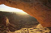 Washer Woman Arch seen through Mesa Arch at sunrise. Island in the Sky district. Canyonlands National Park. Utah. USA