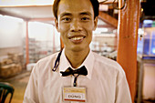 Waiter. Ho Chi Minh City. Vietnam.