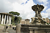 Bocca della Veritá square. Old Forum Boarium. Fountain, Vestas Temple and Temple of Fortuna Virilis at background. Rome. Italy