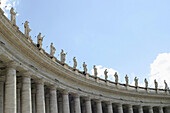 Colonnade crowned by statues. St. Peters Square. Vatican City. Rome. Italy