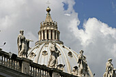 Statues and Dome of St. Peters Basilica. Vatican City. Rome. Italy