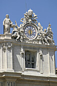 Clock above the facade of St. Peters Basilica. Vatican City. Rome. Italy