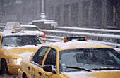 Yellow taxis on Park Avenue in snow storm. New York City, USA