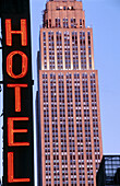 Empire State building and hotel sign, New York City. USA