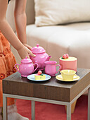 girl playing tea house with toys