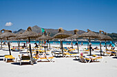 Sun Beds and Umbrellas at Port d'Alcudia Beach, Port d'Alcudia, Mallorca, Balearic Islands, Spain