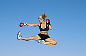 woman boxer leaping