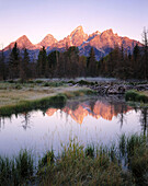 Dawn over the Teton Range from Beaver Pond along the Snake river. Grand Teton National Park. Wyoming. USA.