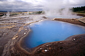 Turquoise coloured hot spring at Geysir. Iceland.