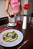 Spinach crêpes and salmorejo  (bread and tomato cold soup) with nuts. El Pecado Restaurant. Jaén. Andalusia, Spain