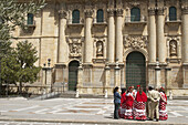 People in traditional costume in front of the cathedral (16th century), Jaén. Andalusia, Spain