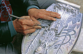 Chinese craftsman, Lijiang. Yunnan. China