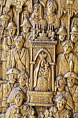 Religious scene carved in the wood of the doors of the Church of San Pietro e Paolo, Pescasseroli. LAquila, Abruzzo, Italy