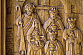 Religious scene carved in the wood of the doors of the Church of San Pietro e Paolo, Pescasseroli. LAquila, Abruzzo, Italy