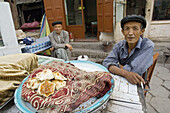 A uigur seller of bread. Kashgar. Xinjiang province. China. Asia.