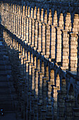 Roman aqueduct in the evening, Segovia. Castilla-Leon, Spain