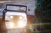 Jeep in water. Ilhabela. Brazil